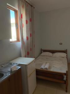 Postel nebo postele na pokoji v ubytování Begaj Rooms