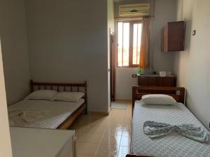 Postel nebo postele na pokoji v ubytování Begaj Rooms