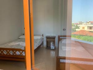 Postel nebo postele na pokoji v ubytování Begaj Rooms