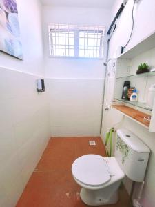 a small bathroom with a toilet and a window at Homestay BAYT AL - JAZMY in Kuantan +46 photos