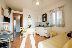 a room with a kitchen and a living room at Apartment Kamenar 3 in Klimno