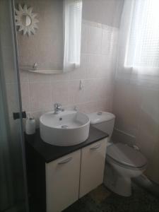 a bathroom with a sink and a toilet at Maison du soleil in Prades +16 photos