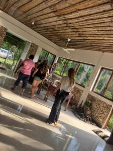 a group of people playing a video game in a building at JozaniBiospherevillage in Jozani