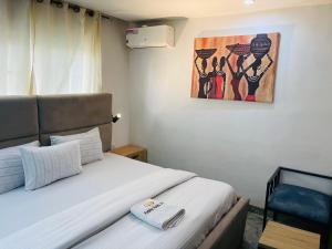 Postel nebo postele na pokoji v ubytování Hotel Padelia Apartment Airport Road Lagos
