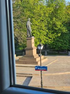 a statue of a man on top of a monument at Old Town View in Rzeszów +9 photos