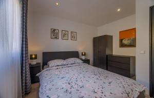 a bedroom with a bed and two night stands at Apartman Cukar Pula in Pula
