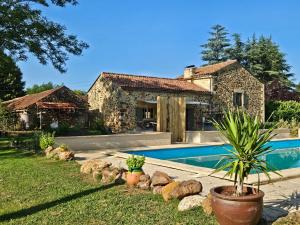 a house with a swimming pool in front of it at B&B La Taupinière Rustique table d'hôtes gastronomique in Mazeyrolles