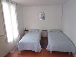Postel nebo postele na pokoji v ubytování Chambre privée a Arcueil - Cachan