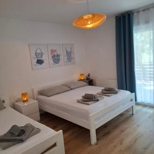 Postel nebo postele na pokoji v ubytování Magnolia Apartments