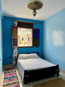 Postel nebo postele na pokoji v ubytování Moroccan Family House