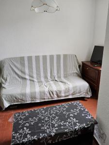 A bed or beds in a room at Le Cardinale in Barcarès Beach 4 people