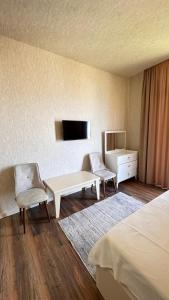 TV a/nebo společenská místnost v ubytování Villa Mandarina