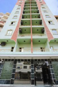 an apartment building with a lot of windows at برج اللوتس 2 شقق فندقية مكيفة للايجار in Marsa Matruh