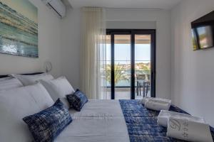 Posteľ alebo postele v izbe v ubytovaní Penthouse Apartments Dora Kukljica