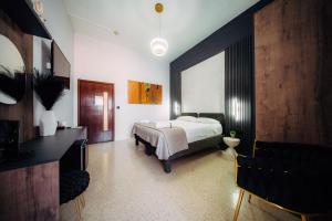 Rúm í herbergi á Rapture Gozo - Guesthouse