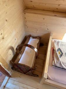 a wooden room with a light inside of it at Bungalov Veruša in Podgorica +4 photos
