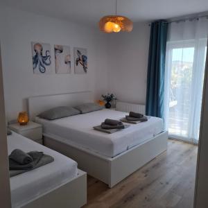 Postel nebo postele na pokoji v ubytování Magnolia Apartments