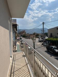 a balcony of a building with a street and a street light at Victoria's & Anna's Apartments in Sami