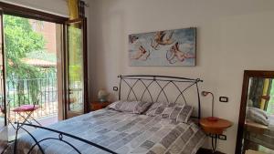 a bedroom with a bed and a picture of deer on the wall at Casa Fiorello in Città della Pieve