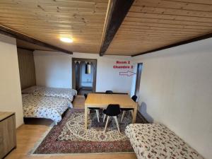 Voodi või voodid majutusasutuse Chambre d'Hôtes R&S toas