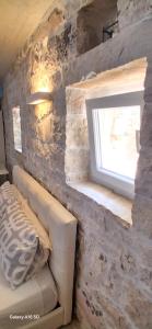 Ένα ή περισσότερα κρεβάτια σε δωμάτιο στο Cosy Studio with breathtaking view