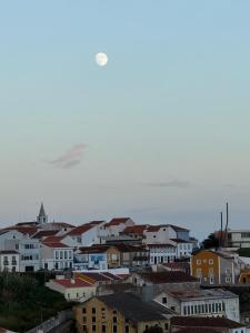 a view of a city with houses and buildings at Ponto de vista in Angra do Heroísmo +6 photos