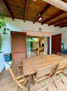 a wooden table and chairs on a patio at Casa en Sant Antoni de Calonge in Calonge