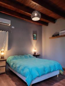 Postel nebo postele na pokoji v ubytování La Cholita Villa Tacu + 13 fotografií