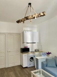 a room with a kitchen with a stove and a microwave at Studio Bareges Le Rioulet 1 in Barèges