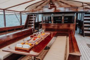 a table on the back of a boat at Behike Luxury Phinisi in Labuan Bajo
