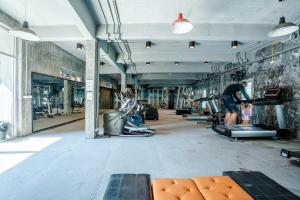 a gym with several people exercising on tread machines at Sea La Vie Villa Q1 3 Bedrooms Near Beach in Amphoe Koh Samui