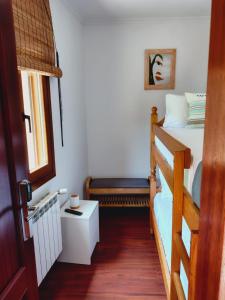 a bedroom with a bunk bed and a window at Casa MARIO y MARIOLA in Santoña +116 photos
