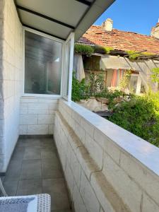 a balcony with a window in a house at Studio Thermi 1 in Varna City