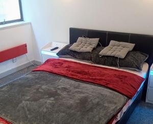 a bedroom with a large bed with two pillows on it at GORGEOUS FlatD Central London Liverpool St Station in London +38 photos