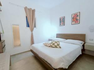 a bedroom with a large bed in a room at B&B Petrae House in Ostuni