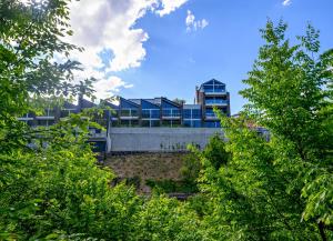 a building in the middle of some trees at Dilijan Inn Hotel and Restaurant in Dilijan +76 photos