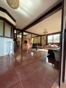a living room with a couch and a table at Casa da Tartaruga Búzios in Búzios