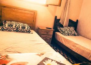 Postel nebo postele na pokoji v ubytování Hotel afriquia