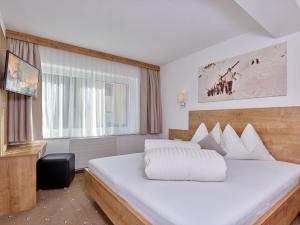 Postel nebo postele na pokoji v ubytování Appartement Gästehaus Bergkristall