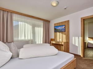 Postel nebo postele na pokoji v ubytování Appartement Gästehaus Bergkristall