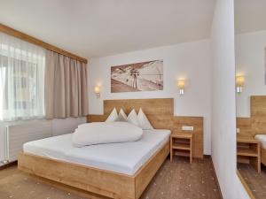 Postel nebo postele na pokoji v ubytování Appartement Gästehaus Bergkristall