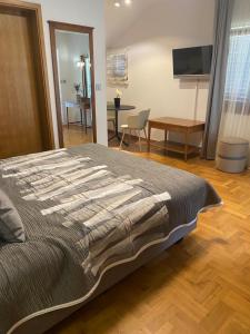 Et tv og/eller underholdning på Apartmani Bianca