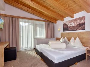 Postel nebo postele na pokoji v ubytování Appartement Gästehaus Bergkristall
