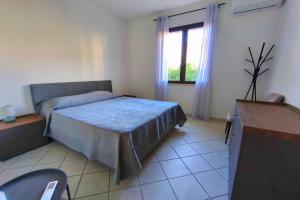 En eller flere senge i et værelse på Villa Rosalia