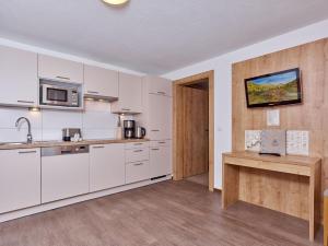 Kuchyň nebo kuchyňský kout v ubytování Appartement Gästehaus Bergkristall