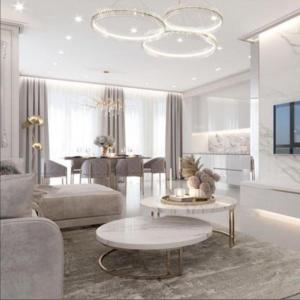 a living room with a couch and a table at Luxary Home Flora inn in Baku