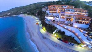 an aerial view of a beach with buildings and the ocean at Karaoulanis Beach in Agios Ioannis Pelio