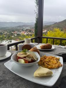 a table with a plate of food on a table at Glamping El Sol Mirador Jarana Villa de Leyva in Villa de Leyva +6 photos