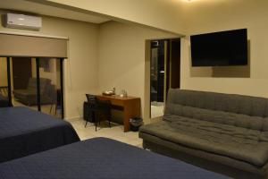 TV a/nebo společenská místnost v ubytování Hotel Casa 20
