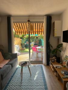 a living room with a couch and a table at Studio le Mistral in Saint-Raphaël